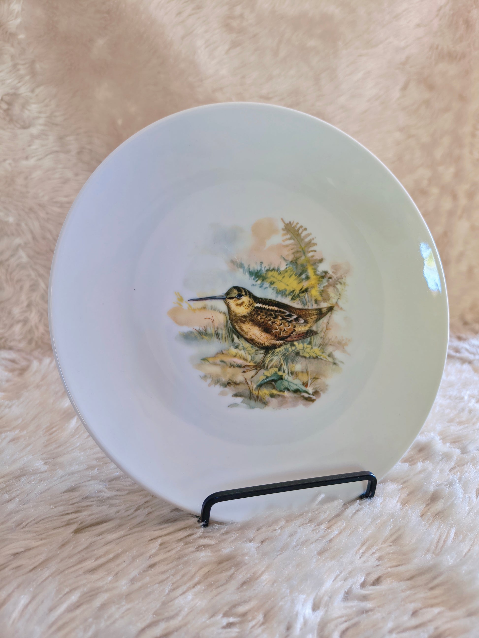 Service d'assiettes en porcelaine décor d'animaux des bois